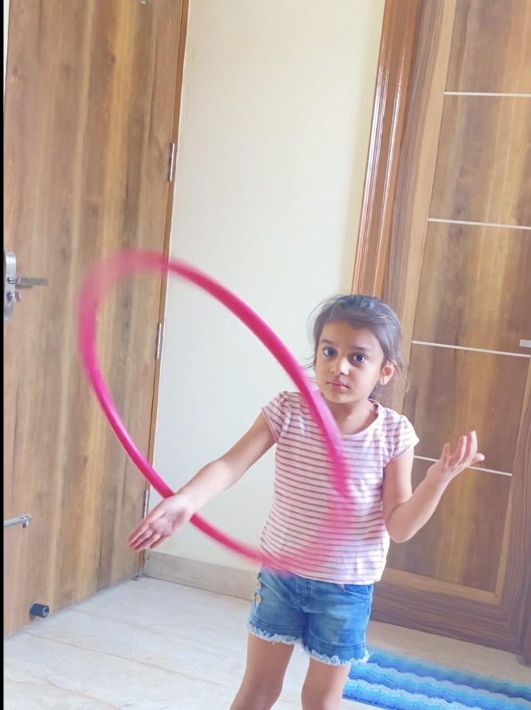 Aadhya Dadhich hula hooping at HoopStar Academy online class